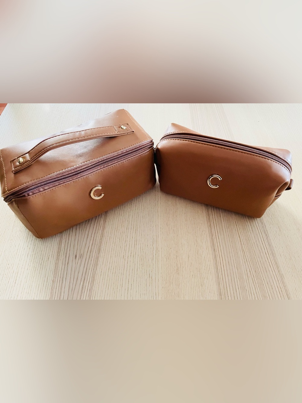 Tan faux leather matching cosmetic bag/ case set, gold “C” emblem, excellent